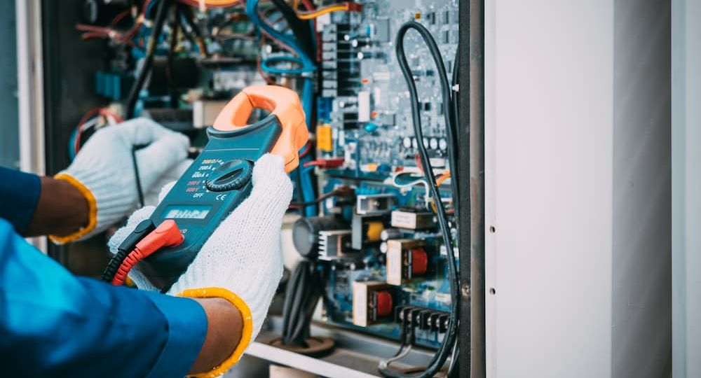 Professional service being performed on a residential furnace, illustrating why it is important to know how often you should have your furnace cleaned or checked.
